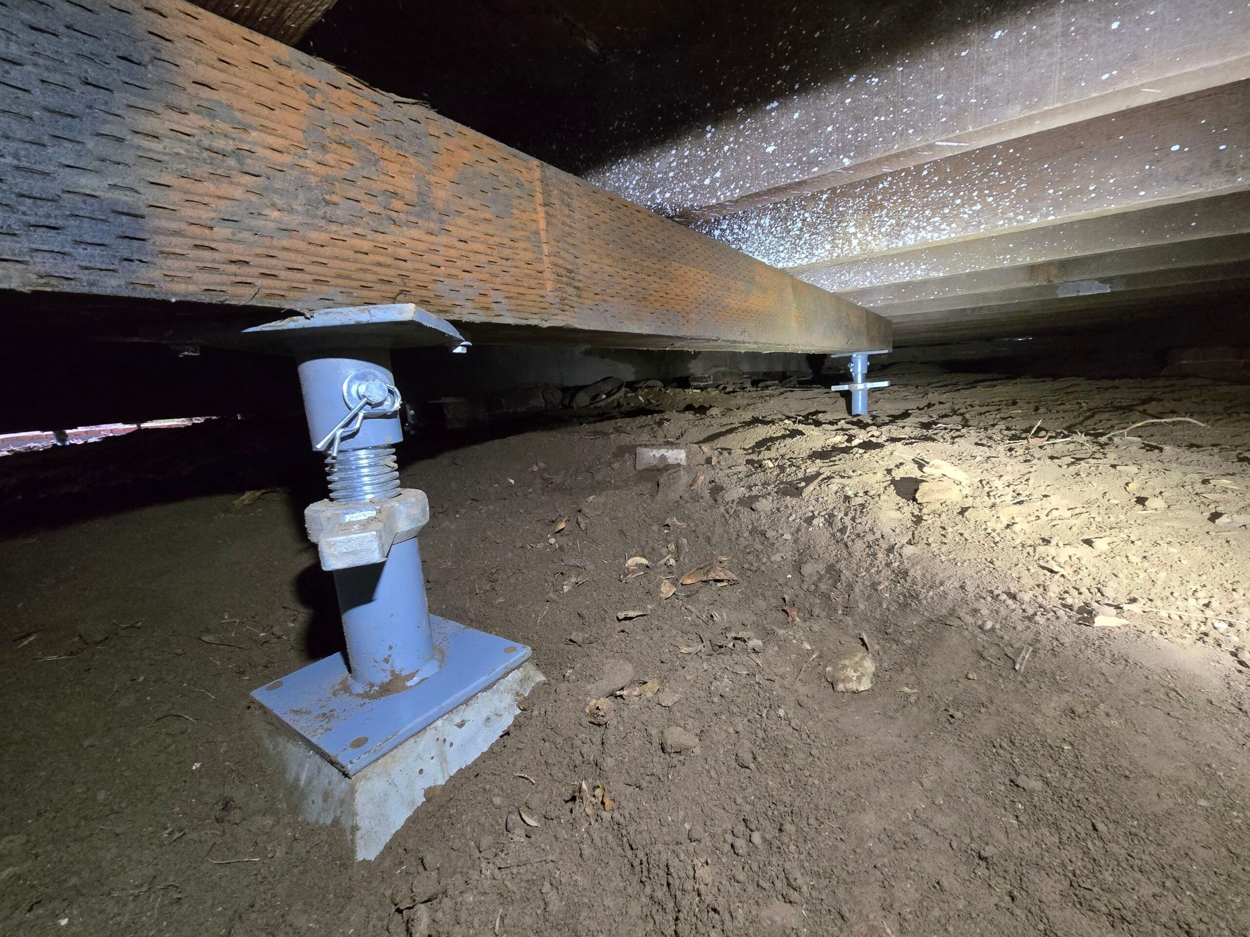 contractor plastering, repairing stucco house foundation after styrofoam insulation